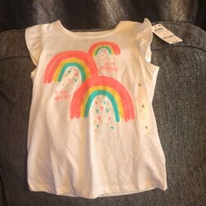 Cute white top with ruffles on the sides!